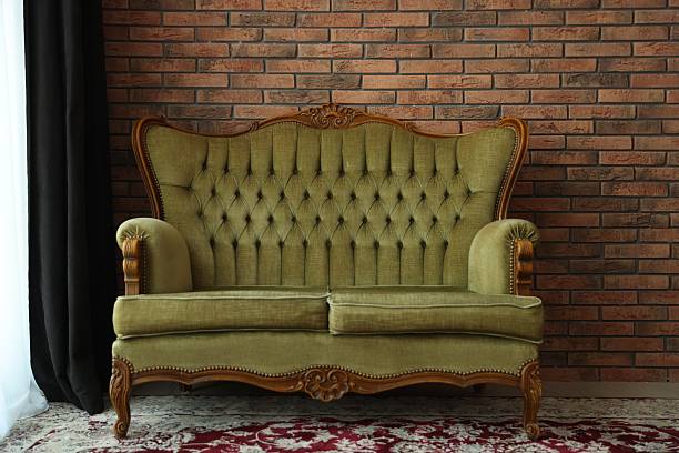 istock Green retro sofa in room. Interior design 2246546593