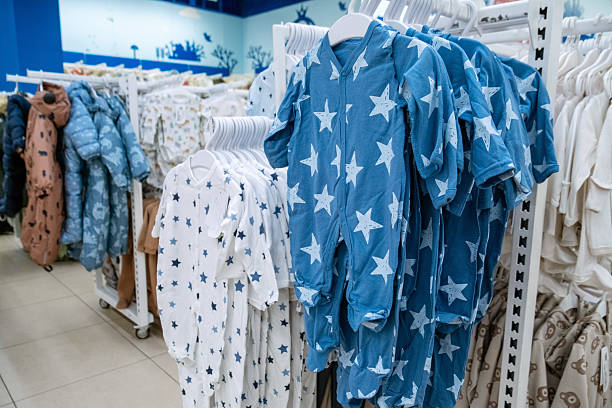 istock Baby Clothes Display in Store with Stroller in Aisle 2246546816