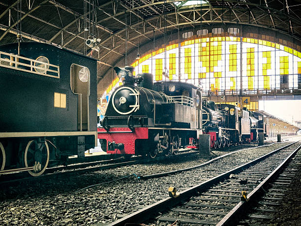 Close up old Steam train of Government operated Bangkok Old central railway station, located at Pathum Wan in Bangkok's China Town (Yaowarat) 350 metres from the Chao Phraya river. Completed in 1916 based on a Neo-Renaissance design. The former central passenger terminal in Bangkok and the former railway hub of Thailand. It is in the center of the city in the Pathum Wan district, and is operated by The State Railway of Thailand.There are still plenty of train services departing from and arriving into Hua Lamphong Railway Station. You can, for instance, still board trains to Pattaya and Aranyaprathet at Hua Lamphong Railway Station.  If you want to go to Kanchanaburi, however, you need to travel across the Chao Phraya (the main river in Bangkok) to Bangkok’s New train terminus, Thonburi Train Station.www.thailandtrains.com/hua-lamphong-station-bangkok/