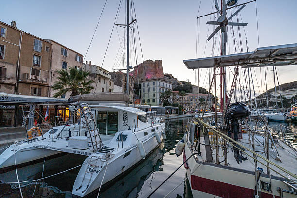 Bonifacio, Corsica, France - October 21, 2025:  Rocks with a castle that rises above the harbor in the town of Bonifacio on the island of Corsica