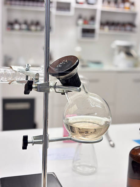 istock Close-up of a laboratory distillation setup featuring a round-bottom glass flask containing liquid, used for scientific experiments and chemical research. 2246550513
