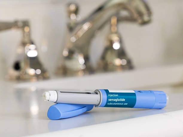 istock GLP-1 Semaglutide injection pen in bathroom on countertop with a white surface 2246550749