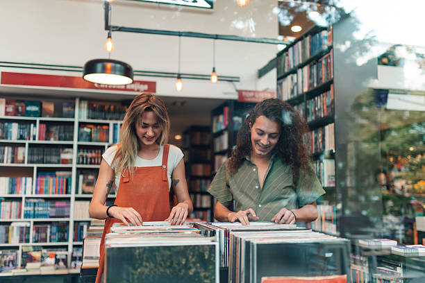istock Young couple browsing vinyl records in music store 2246553058
