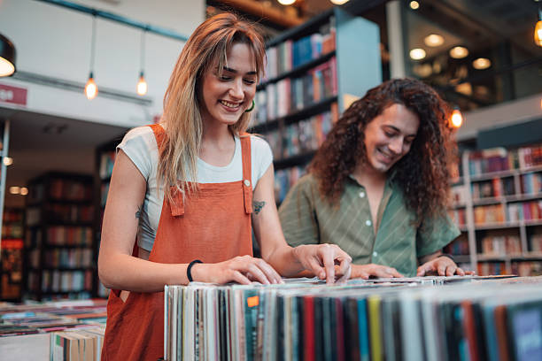 istock Happy couple browsing vinyl records at music store 2246553067