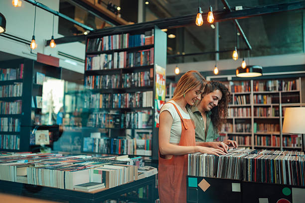 istock Young adults browsing vinyl records in store 2246553072