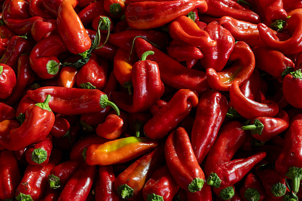 istock Fresh red capia peppers displayed at market stall. 2246553181