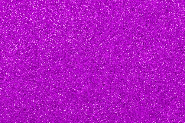 bright purple fuchsia glitter background in horizontal orientation ideal as a very sparkling and vibrant wallpaper
