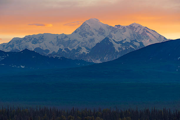 istock Denali's snowy peaks glow under a vibrant sunset. 2246556042