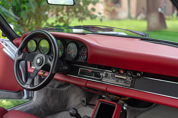 Vilnius, Lithuania - June 20, 2024: Classic Porsche 911SC (G-model) custom made, fully reupholstered with high quality red leather, period correct Recaro bucket seats and Personal steering wheel.