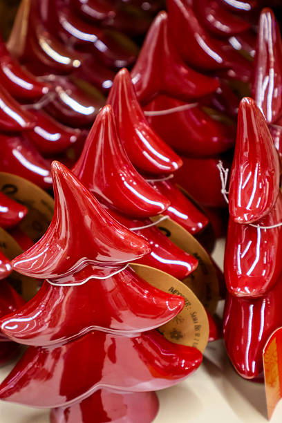 istock Red ceramic Christmas tree figurines, elegant minimalist holiday home decor. Christmas background, ornament. 2246563964