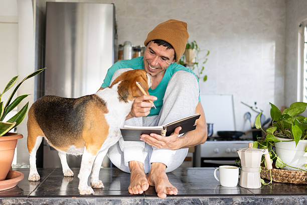 istock Man and beagle dog enjoying simple living while journaling 2246564310