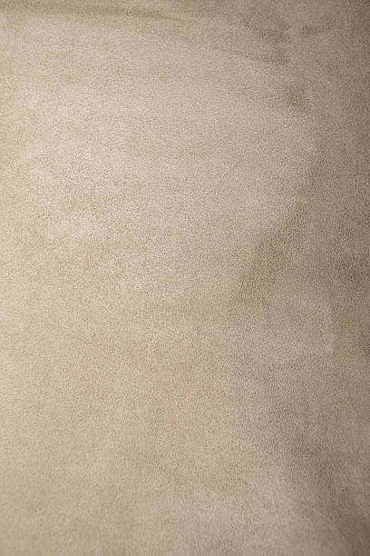 istock Beige suede leather natural background vertical photo. 2246564979