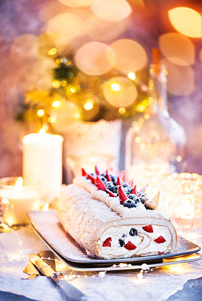 istock Meringue roll cake with cream and fresh berries 2246569239