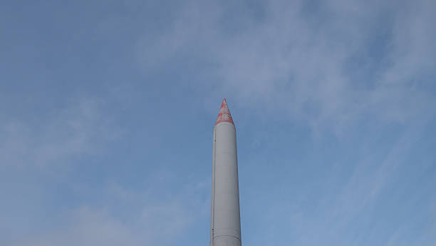 istock vertical rocket sculpture against sky, historical aerospace artifact showcased in open exhibition setting 2246572630