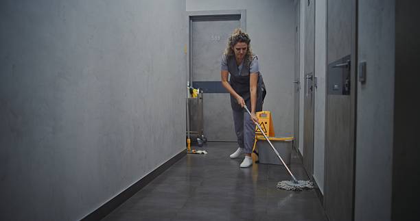 istock Hotel Housekeeper in Grey Uniform Mopping Hallway Floor 2246574095