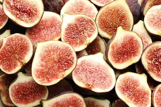 istock Pieces of ripe figs as background, top view 2246581460