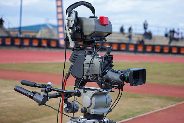 professional television camera on the field sporting event broadcast media filming