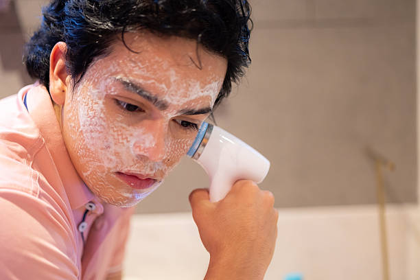 istock Man applying skincare 2246585788