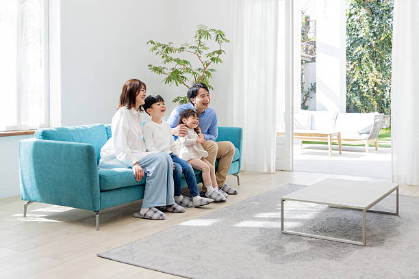 istock Relaxed living room with family 2246591104