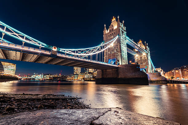 Tower bridge standing majestically in london at night