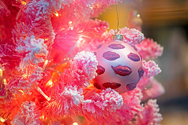 istock Pink Christmas tree with a pink decorative glass ball 2246597873
