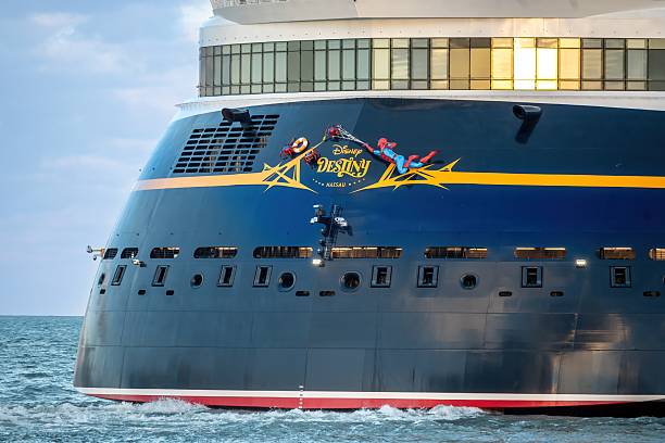 Cape Canaveral, Florida USA-November 4, 2025 - The Cruise ship Disney Destiny heads sea from Port Canaveral. The stern art is clearly visible featuring Marvel character Spiderman. As of this date the ship is the newest passenger vessel in the Disney fleet. It was on a training run with crew before the first official cruise which will be from Fort Lauderdale