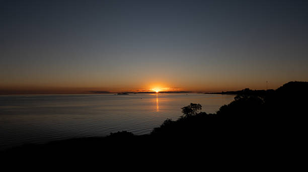 istock beautiful orange sunset at Rio de la plata 2246601069