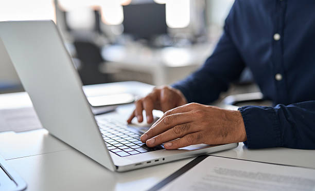 istock Hands of business man typing on laptop working with ai solutions on computer. 2246601301