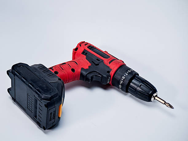 istock Cordless drill with red accents, positioned on a plain white background in a well-lit studio shot 2246601862