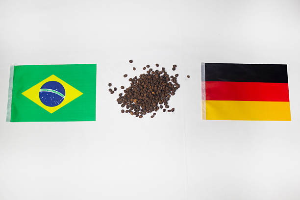 Brazil and Germany flags with coffee beans in the middle in white background
