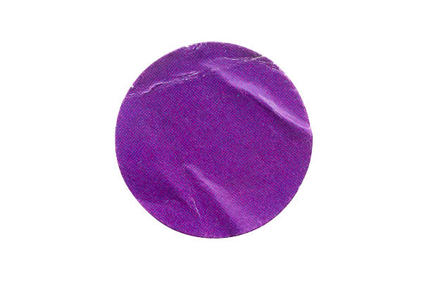 istock Blank purple round adhesive paper sticker label isolated on white background 2246612229