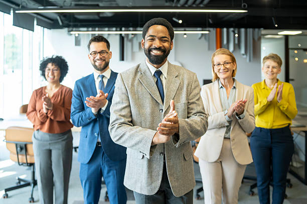 istock Diverse corporate team applauding in office 2246613022