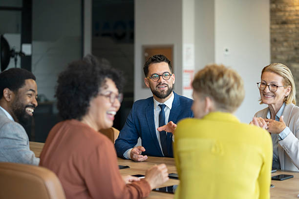 istock Professional team engaged in meeting in bright, modern office environment 2246613034