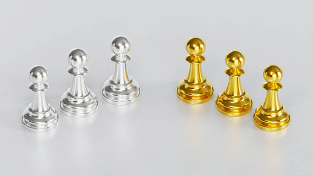 Silver and Golden Chess Pawn Groups Standing Separately with Duality and Contrast on Light Background