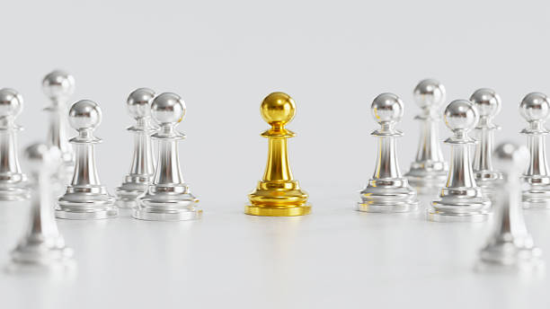 istock Golden Chess Pawn Amidst Silver Pawns Symbolizing Uniqueness Leadership in Competitive Collaborative Group 2246619588
