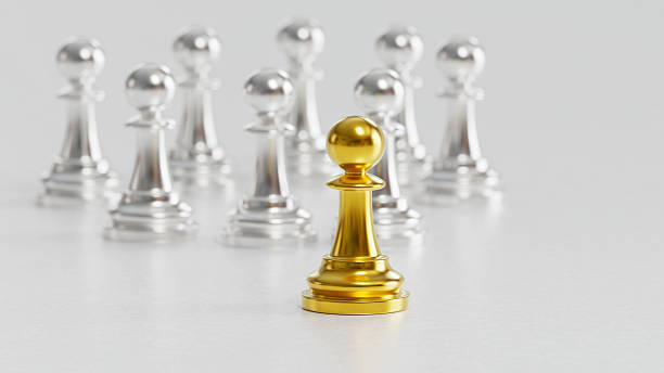 istock Golden Chess Pawn Apart from Silver Pawns Symbolizing Independence & Courage in Distinct Leadership 2246619596