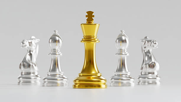 istock Golden King Chess Piece Among Silver Knights & Bishops Symbolizing Authority & Strategic Leadership in Collaborative Strength Coordination 2246619597