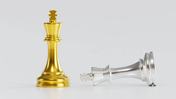 istock Golden King Over Fallen Silver King Symbolizing Decisive Victory & Strategic Supremacy in Competitive Tactical Confrontation 2246619655
