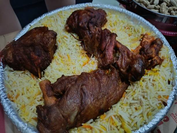 istock Grilled lamb with briyani rice and some spices and pickles 2246619807