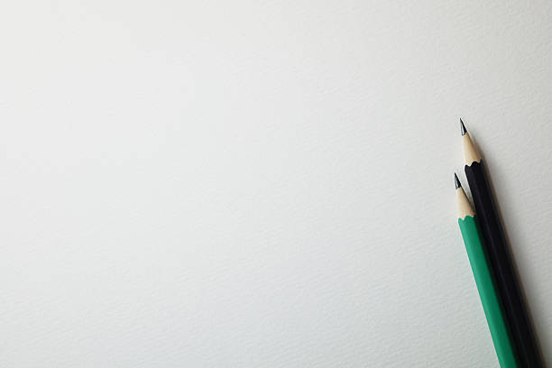 istock Pencils on white paper background 2246620363