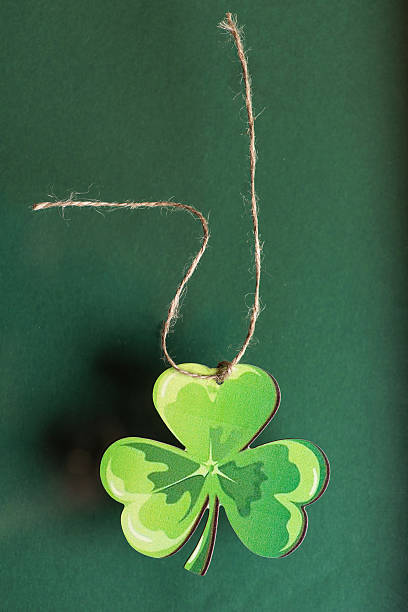 This delightful hanging shamrock decoration illustrates lush green hues, encapsulating the spirit of St. Patrick's Day, symbolizing good fortune and the joy of celebrating Irish culture with friends and family.