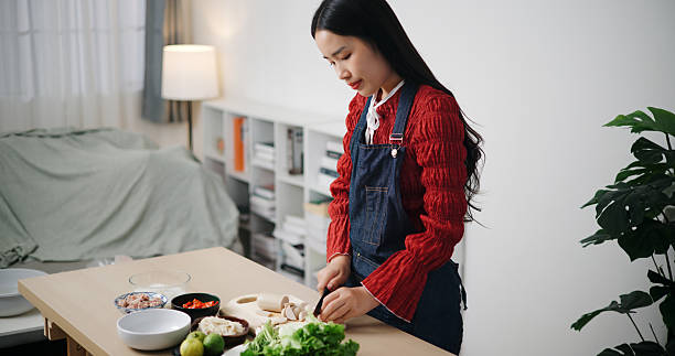 istock Asian woman preparing ingredients for cooking. 2246624384