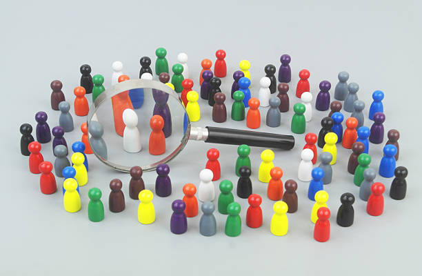 istock Many people figures with magnifying glass. 2246625769