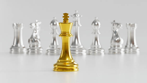istock Golden King with Blurred Silver Chess Set Symbolizing Standout Leadership & Strategic Prominence in Competitive Tactical Environment 2246626777