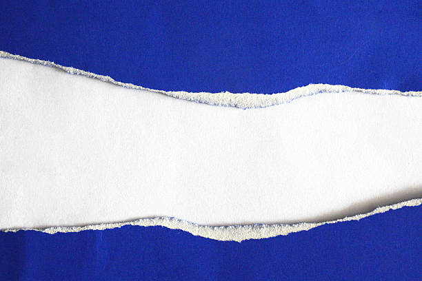 istock A torn piece of white paper on a blue background 2246628027