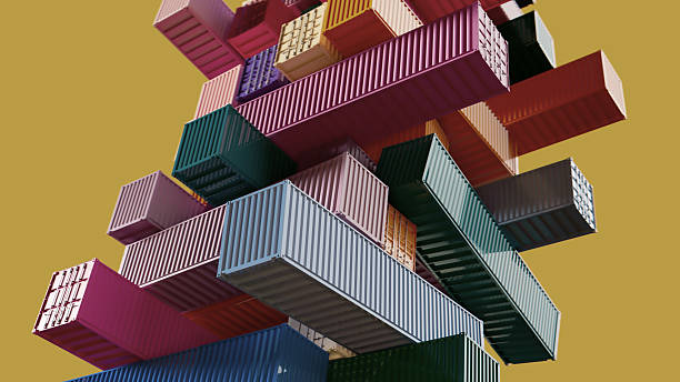 A vibrant arrangement of interlocking shipping containers forms a bold, geometric tower, set against a warm mustard backdrop. The composition conveys energy, scale, and modern industrial aesthetics.