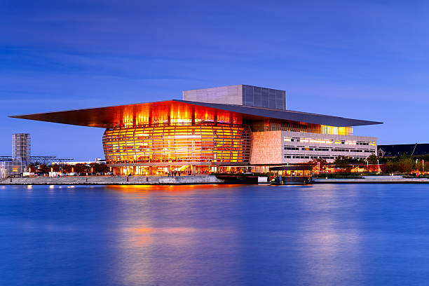 Modern Danish National Opera building in Copenhagen at dusk, Scandinavian architecture.