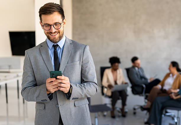 istock In a modern office, a successful businessman multitasks with phone communication 2246638248