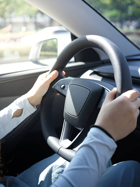 istock Person Holding the Steering Wheel While Driving a Car 2246646292