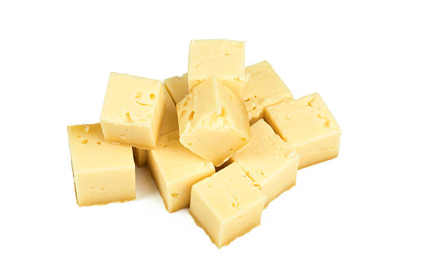 istock Blocks of yellow cheese stacked together on a clean white background 2246647998